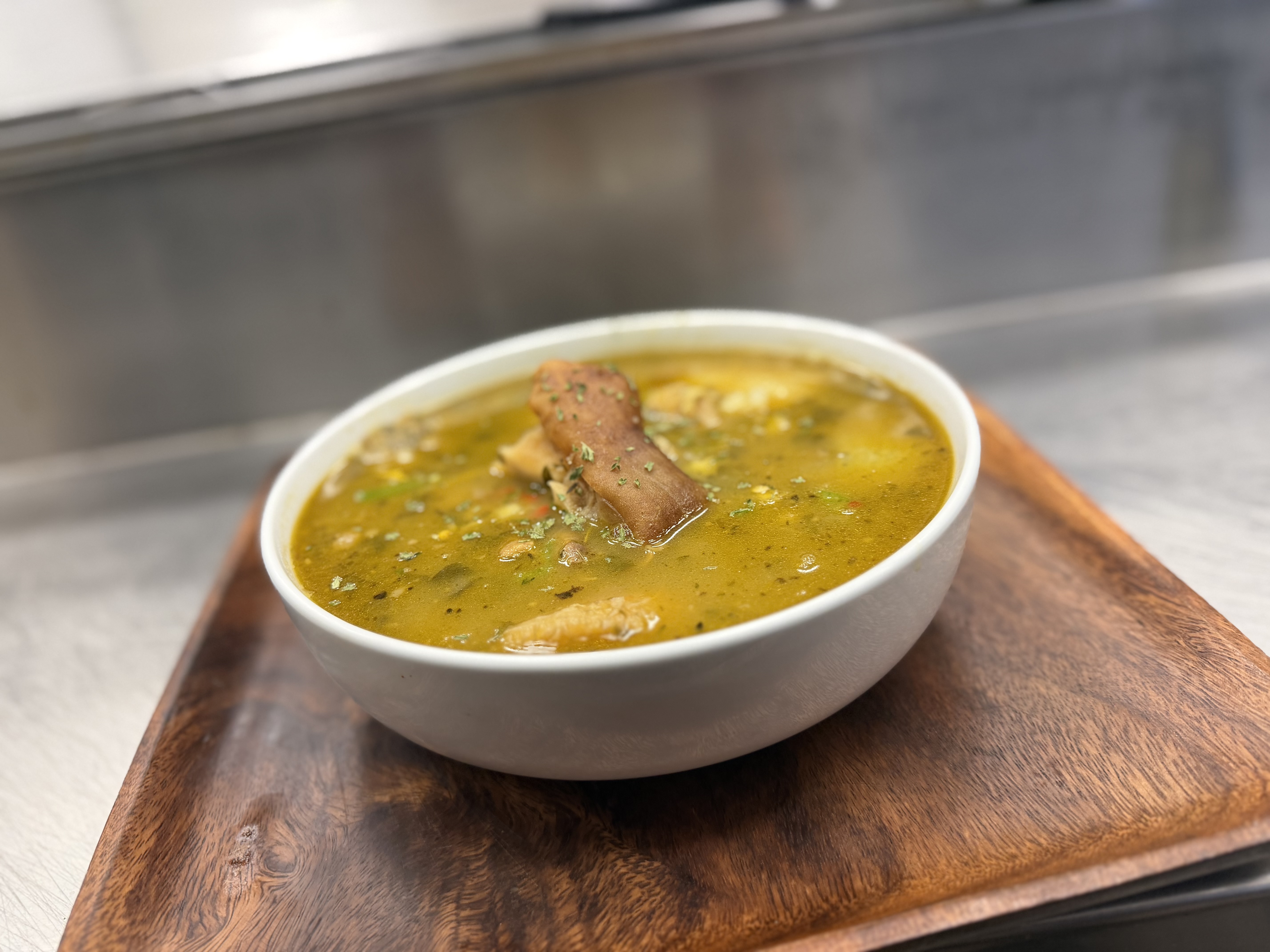 Hearty Haitian Bouyon beef stew with plantains and root vegetables