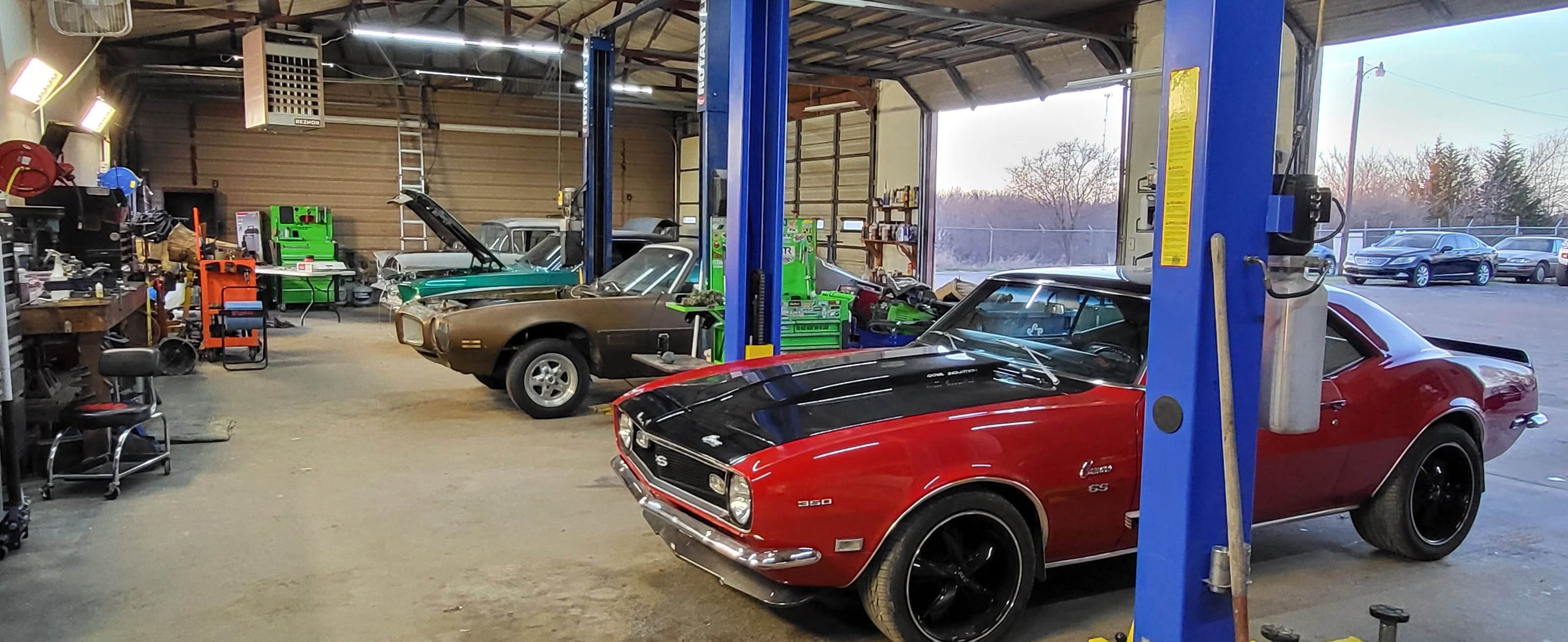 Inside the shop — full line of Rotary lifts with active projects