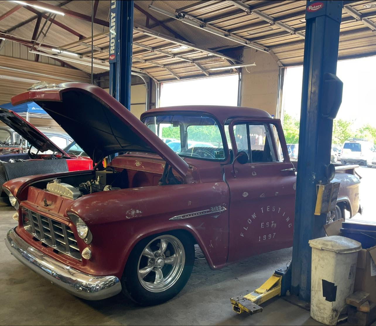 J & J Automotive classic Chevrolet 3100 pickup undergoing restoration on the shop lift