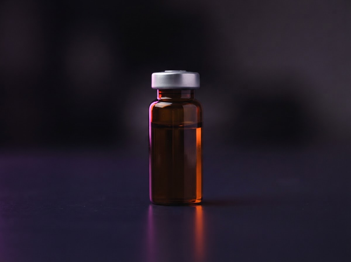 Illustrative men's health treatment vial.