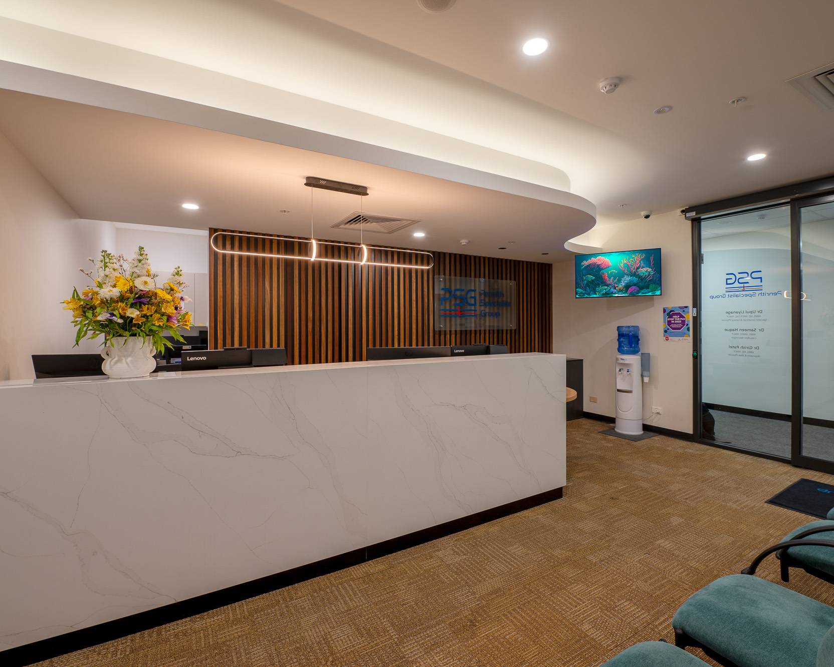 Penrith Specialist Group reception desk and welcome lounge with branded wall