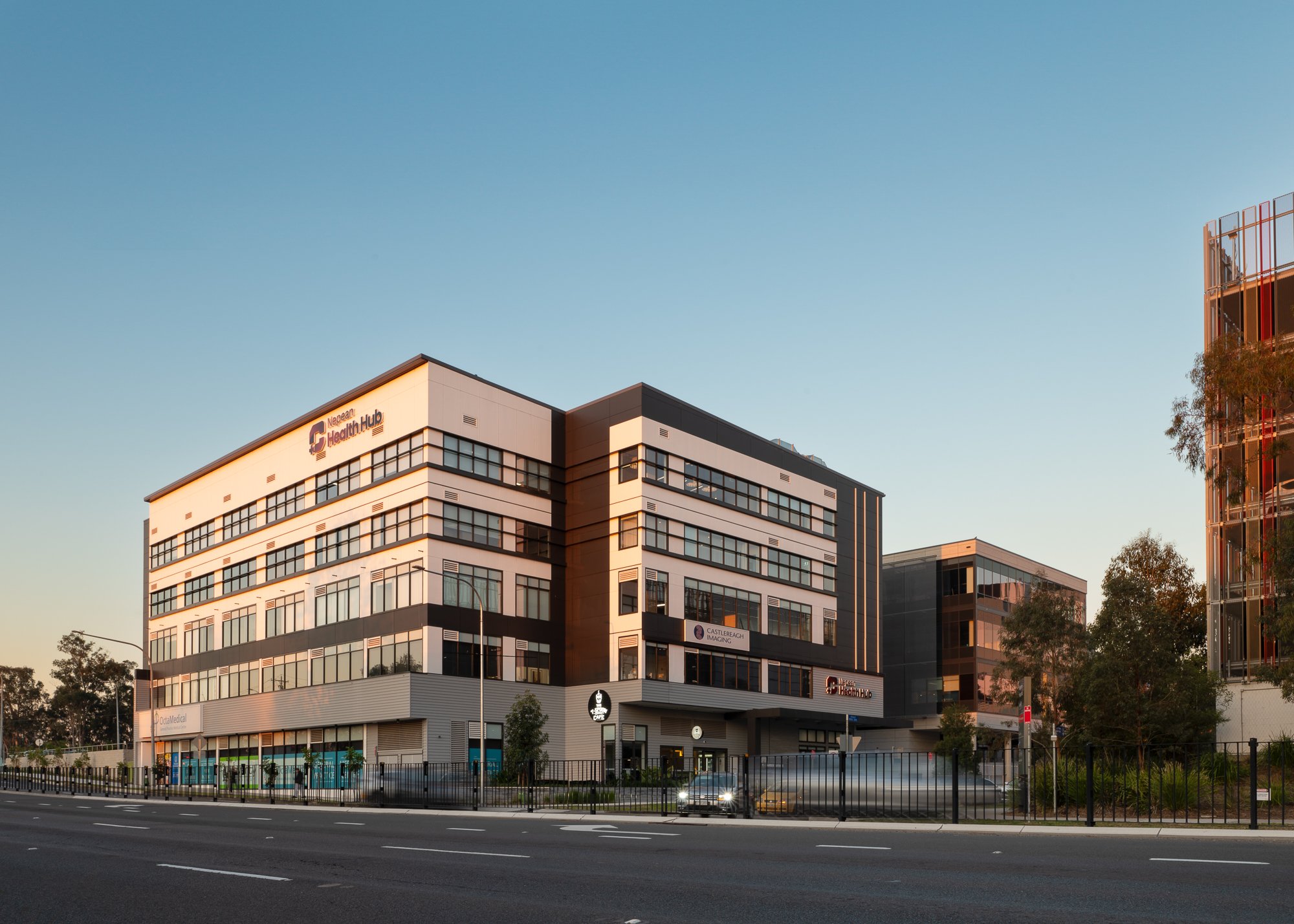 Nepean Health Hub medical precinct building at sunset in warm evening light