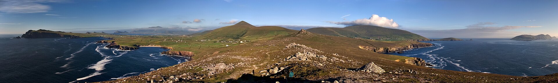 Panoramic view of the green hills and coastline of the Dingle Peninsula