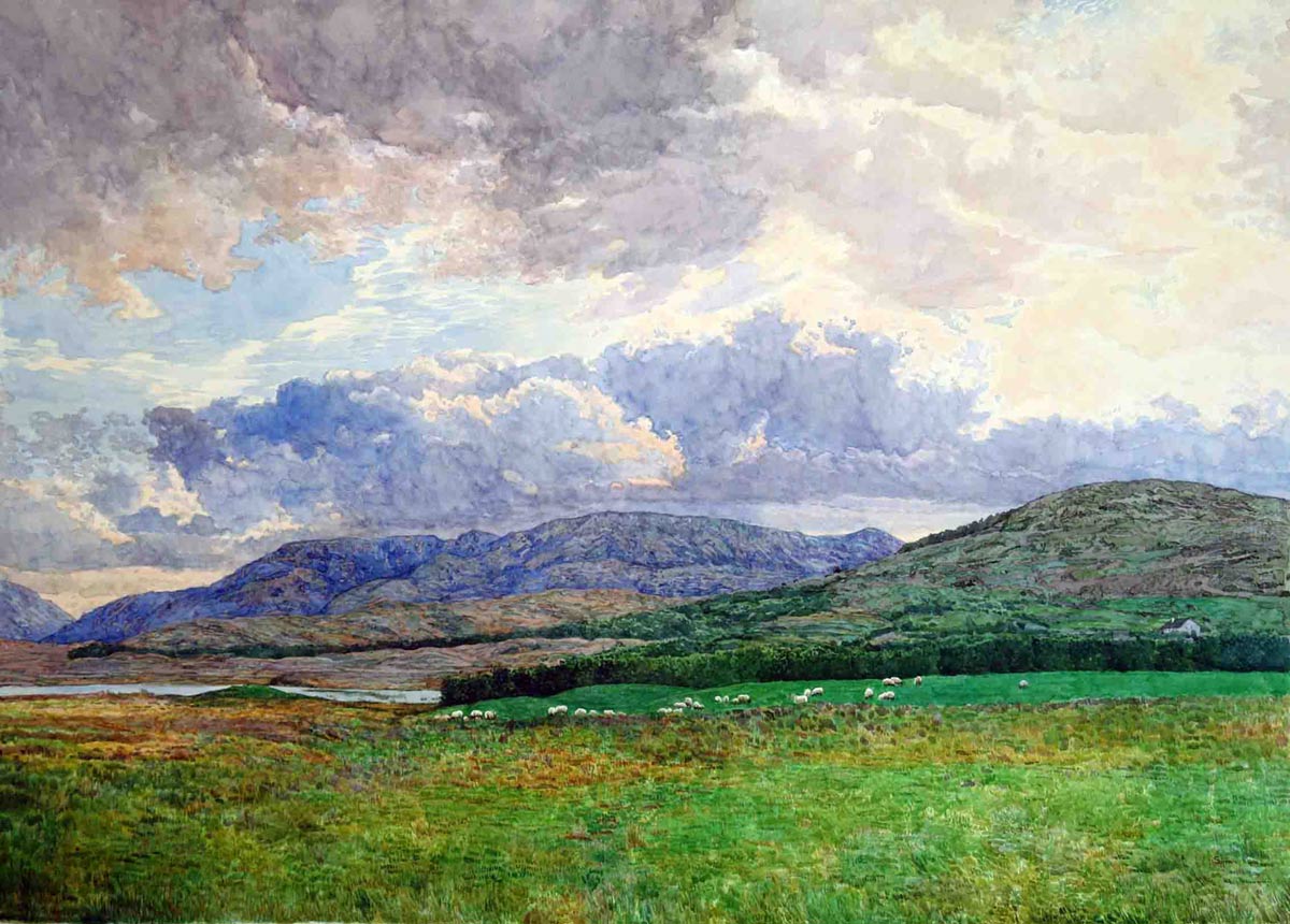 Connemara landscape of lakes and quartzite mountains under a moody sky
