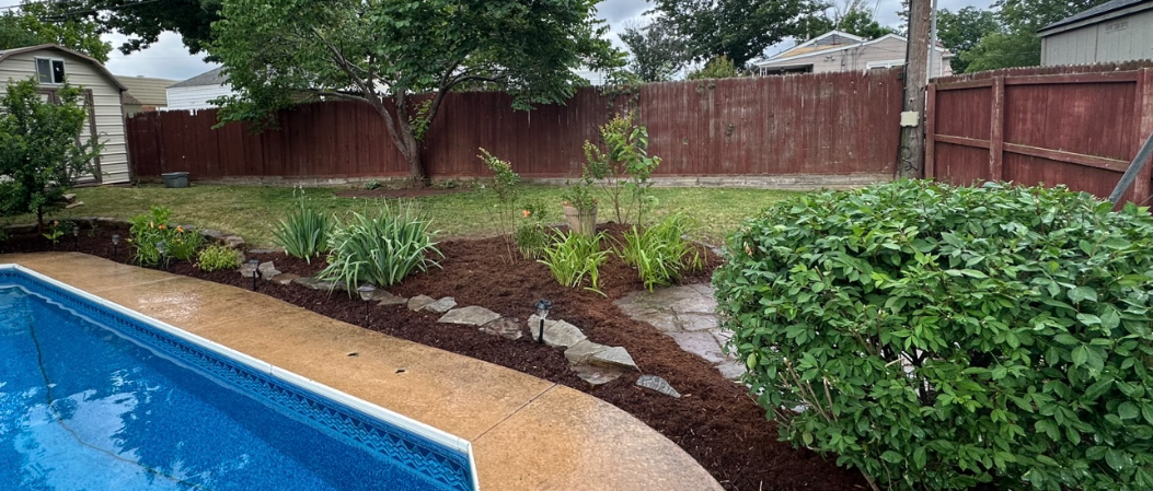 Before and after flower bed restoration in Claremore Oklahoma