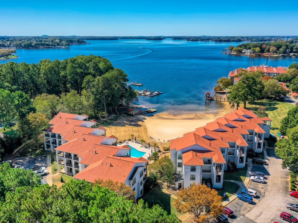 Lake Norman waterfront community with sandy beach, docks, and scenic water views