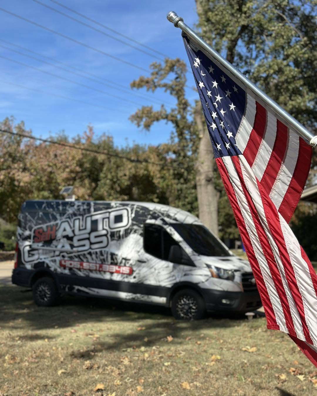 S&H Auto Glass van with American flag