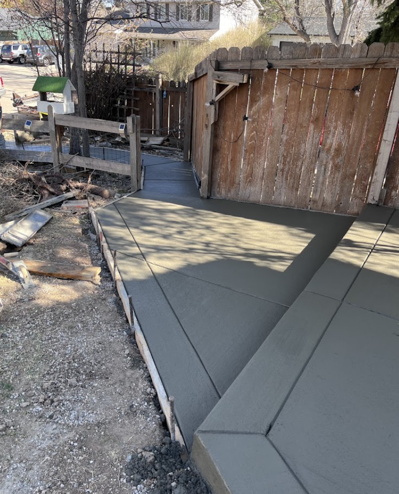 Curved Broom-Finish Walkway & Patio - Standard Concrete completed in Windsor, CO by MCE Construction LLC