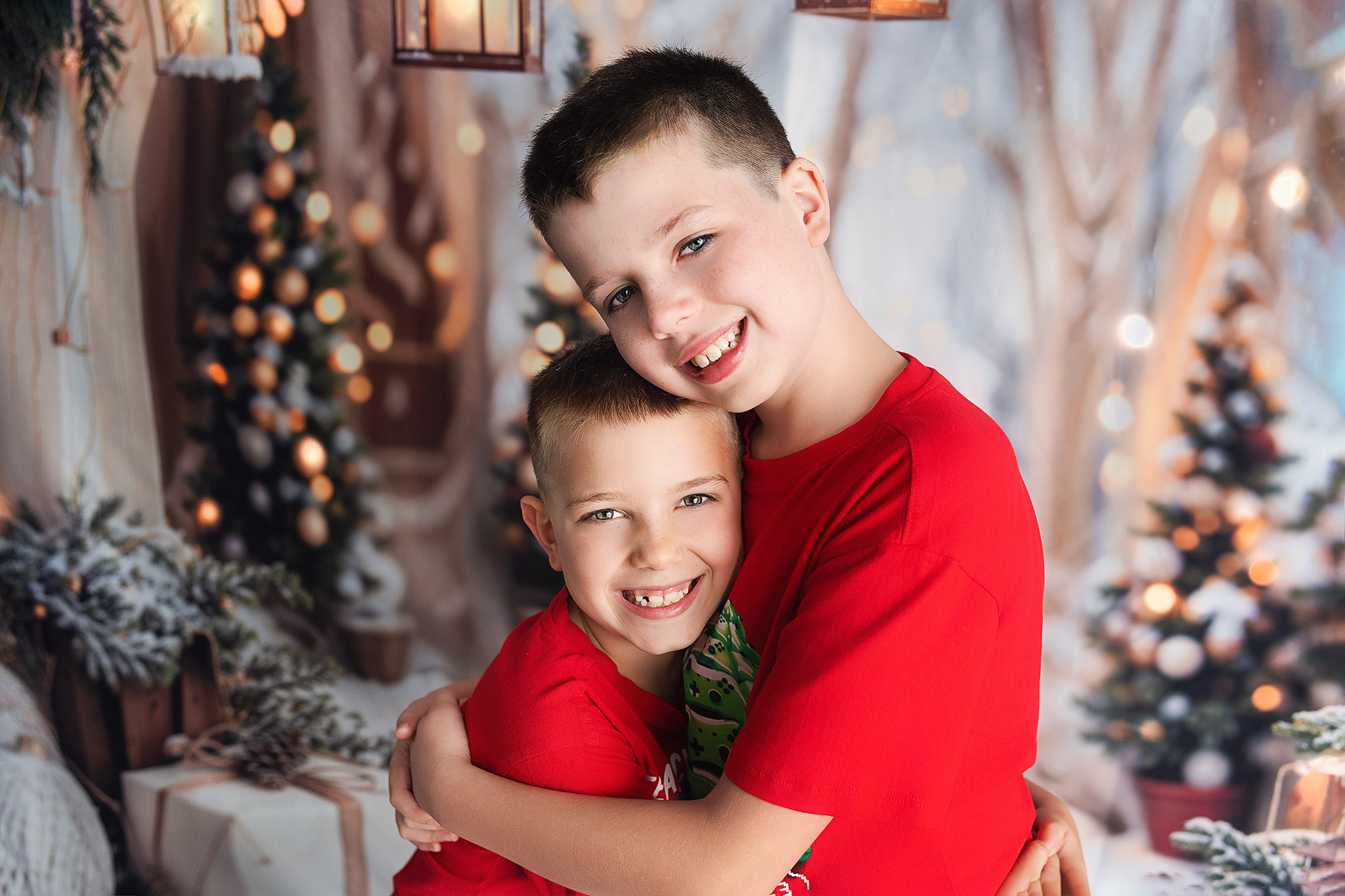 Brothers hugging smiling in Christmas shirts