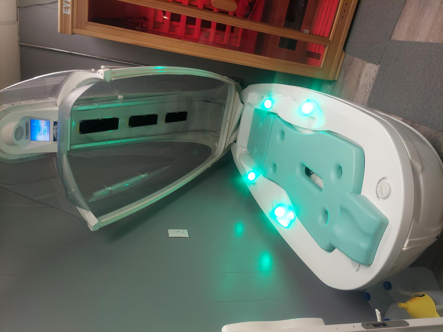 Inside the Cocoon Aqua IR open showing ergonomic bed and illuminated chamber