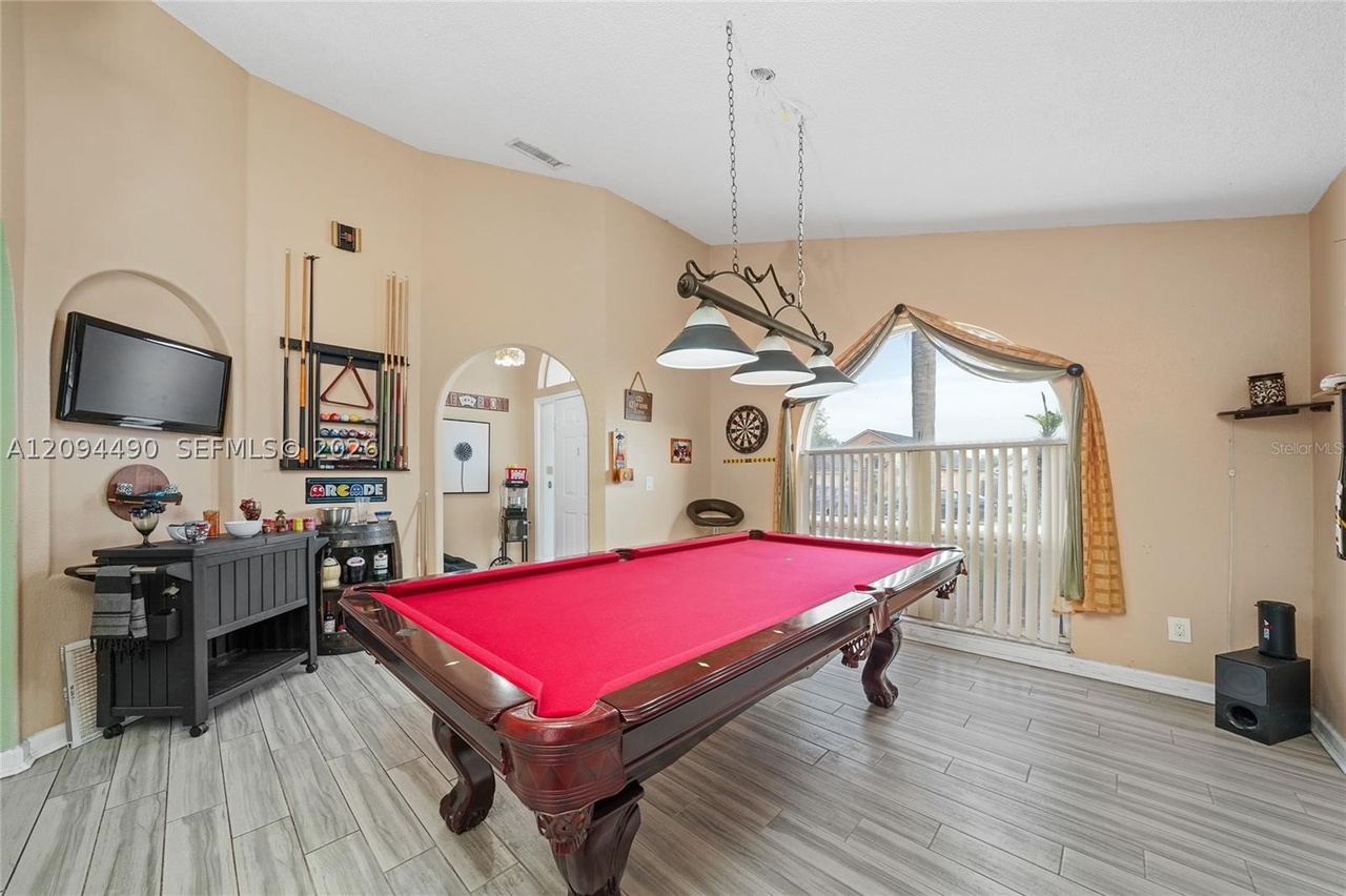 Spacious entertaining & family room with billiards setup