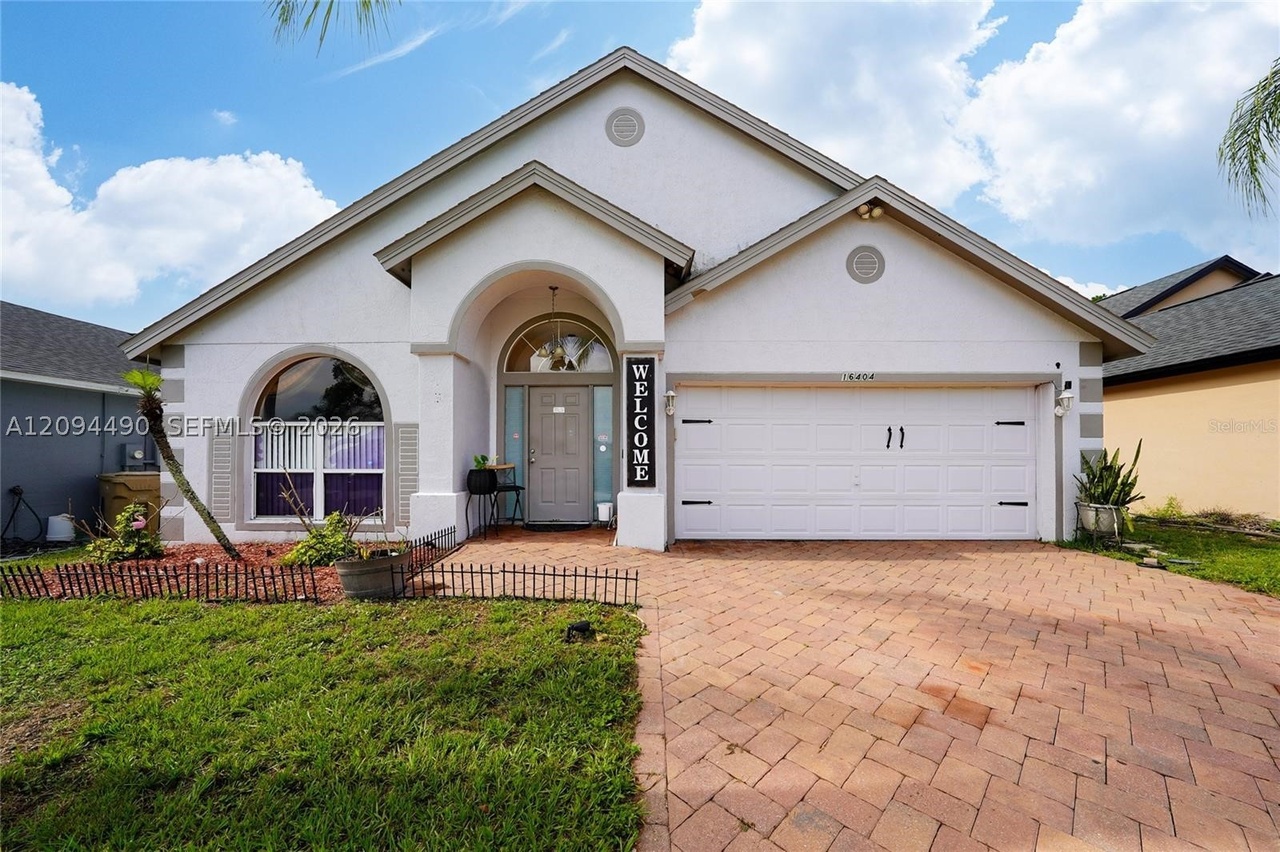 Front elevation, garage, and architectural entry