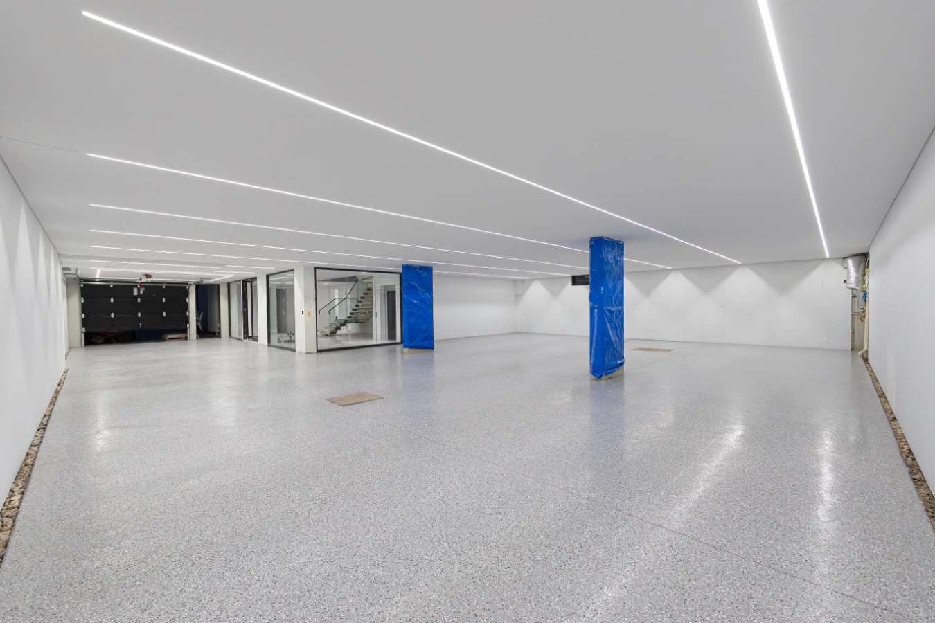 Basement concrete floor slab prior to surface preparation and epoxy coating