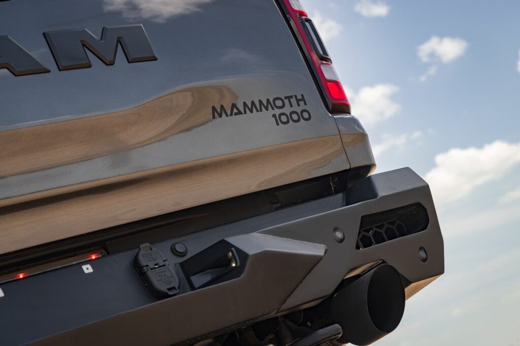 MAMMOTH-branded steel rear bumper with dual exhaust surrounds