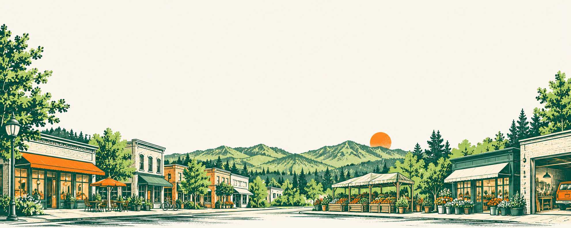 Idaho main street with local storefronts, market stall, and mountains
