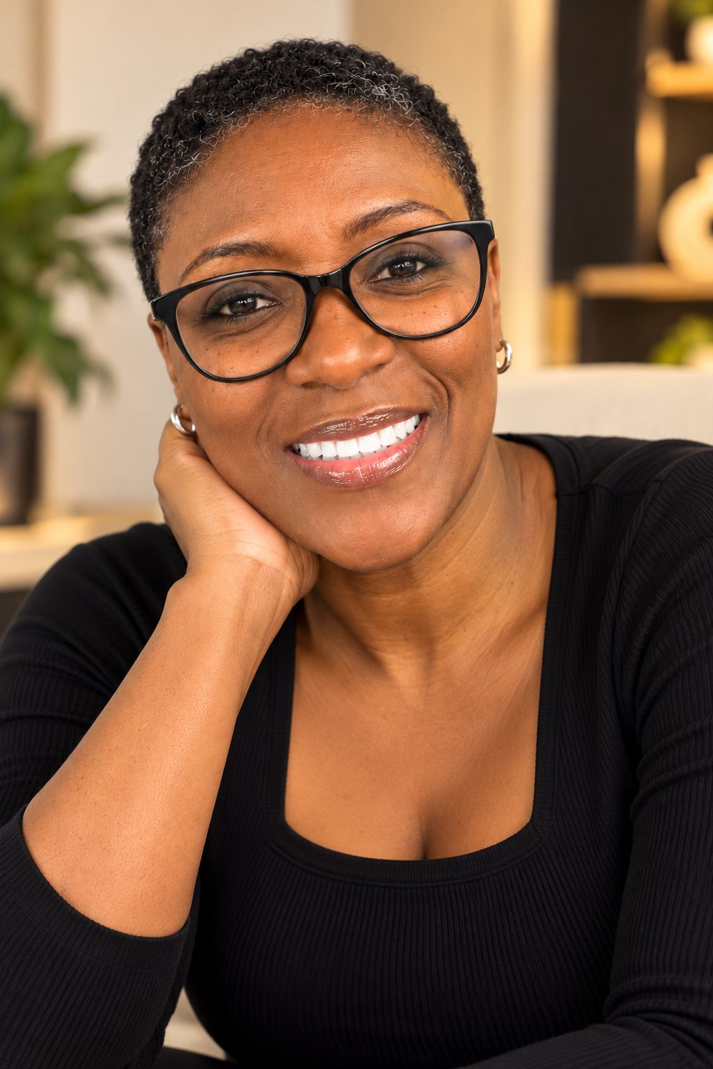 Mekka Williams smiling warmly, seated