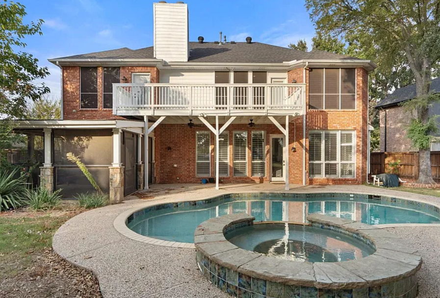 Luxury Frisco home at twilight with pool and golf-course view