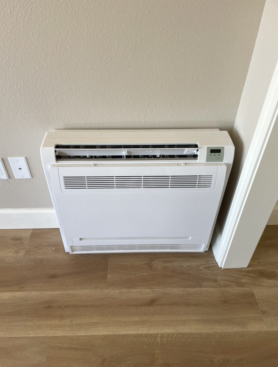Clean low-wall ductless mini-split console air handler installed by Kimber Heat & Air for zoned heating and cooling