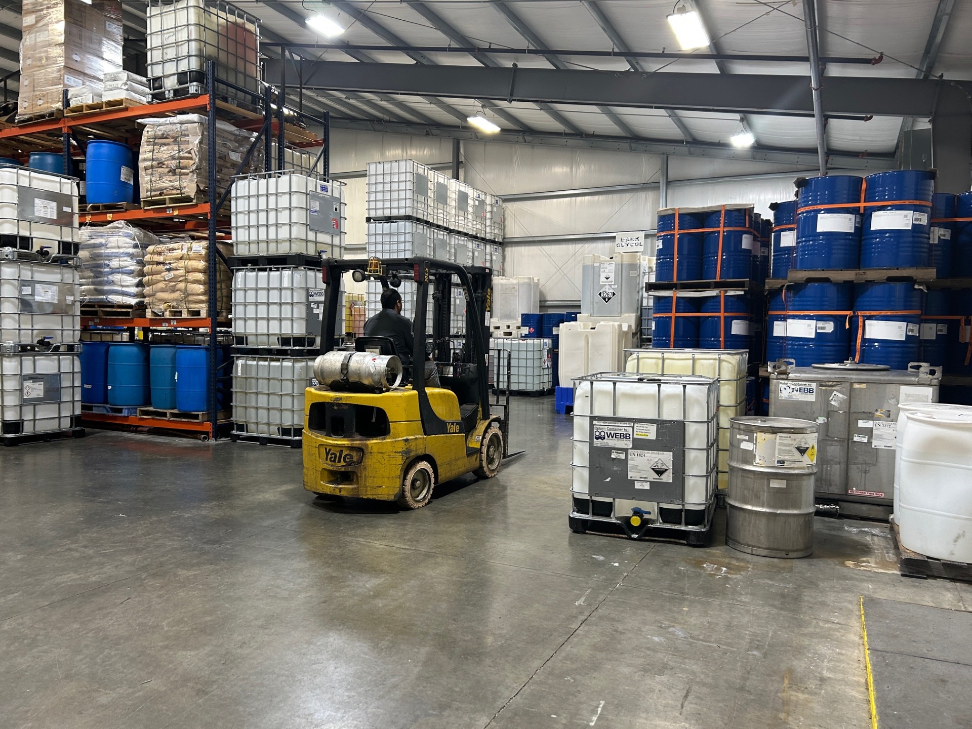 Chemical distribution operations and warehouse staging with forklift and drum packaging