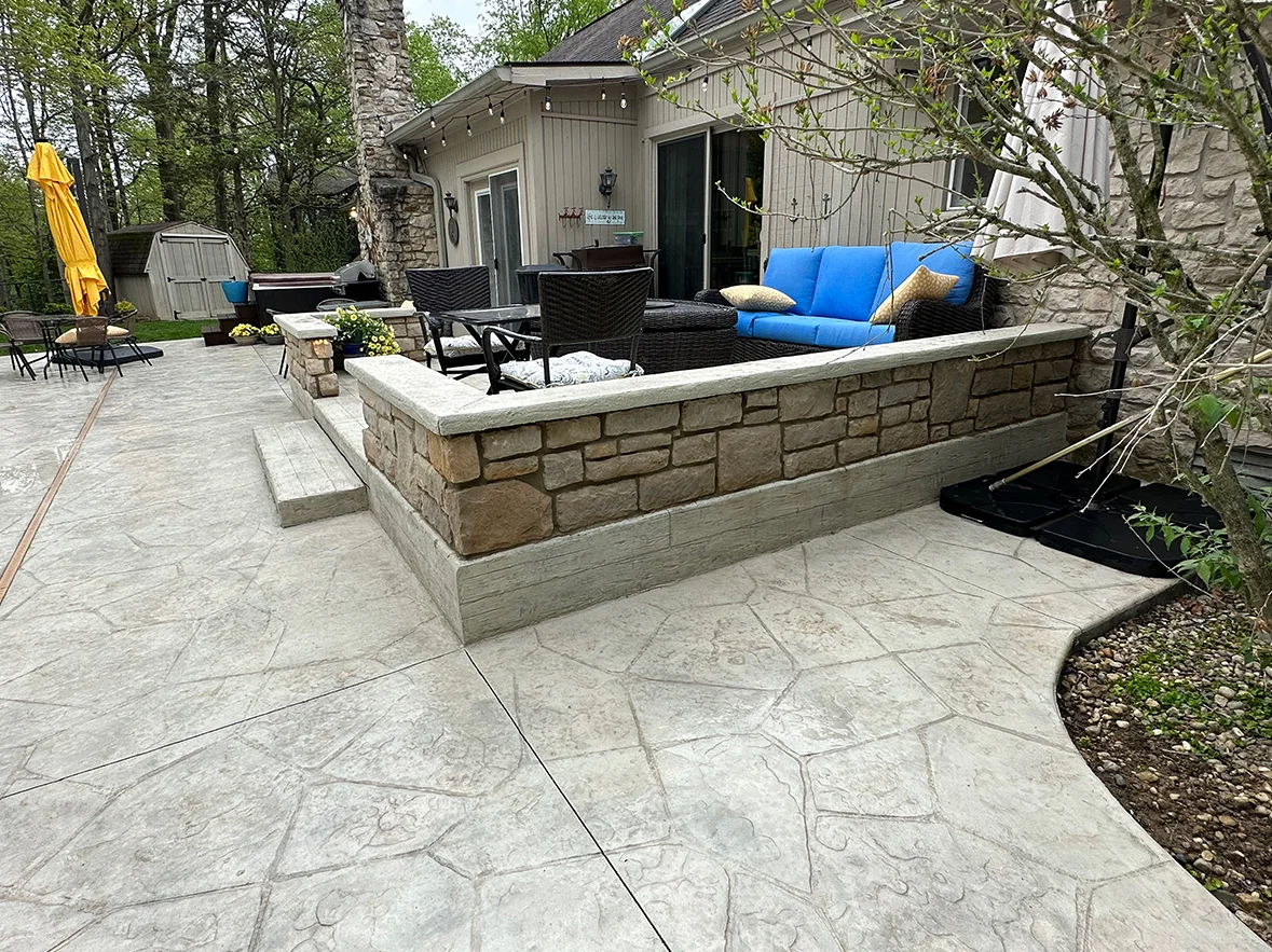 Zionsville Stamped Patio with Natural Stone Seat Wall