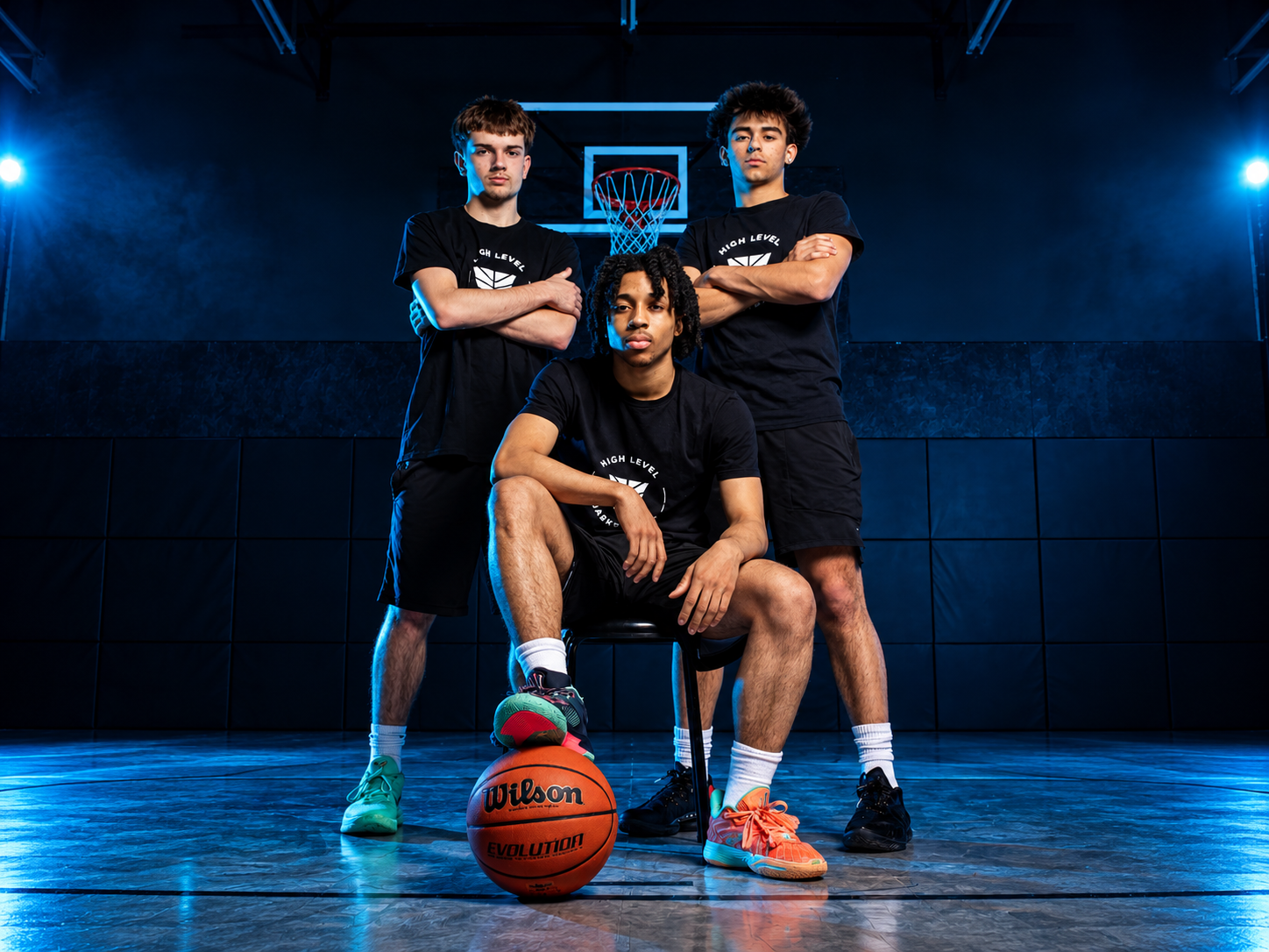 Boys small group basketball training athletes on court