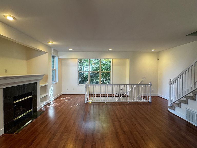 Interior of 13310 132nd Ave NE #D, Kirkland — open great room with granite fireplace