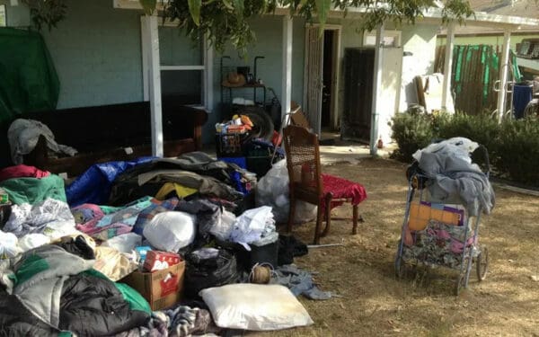 Rental property with heavy clutter and difficult tenant purchased as-is
