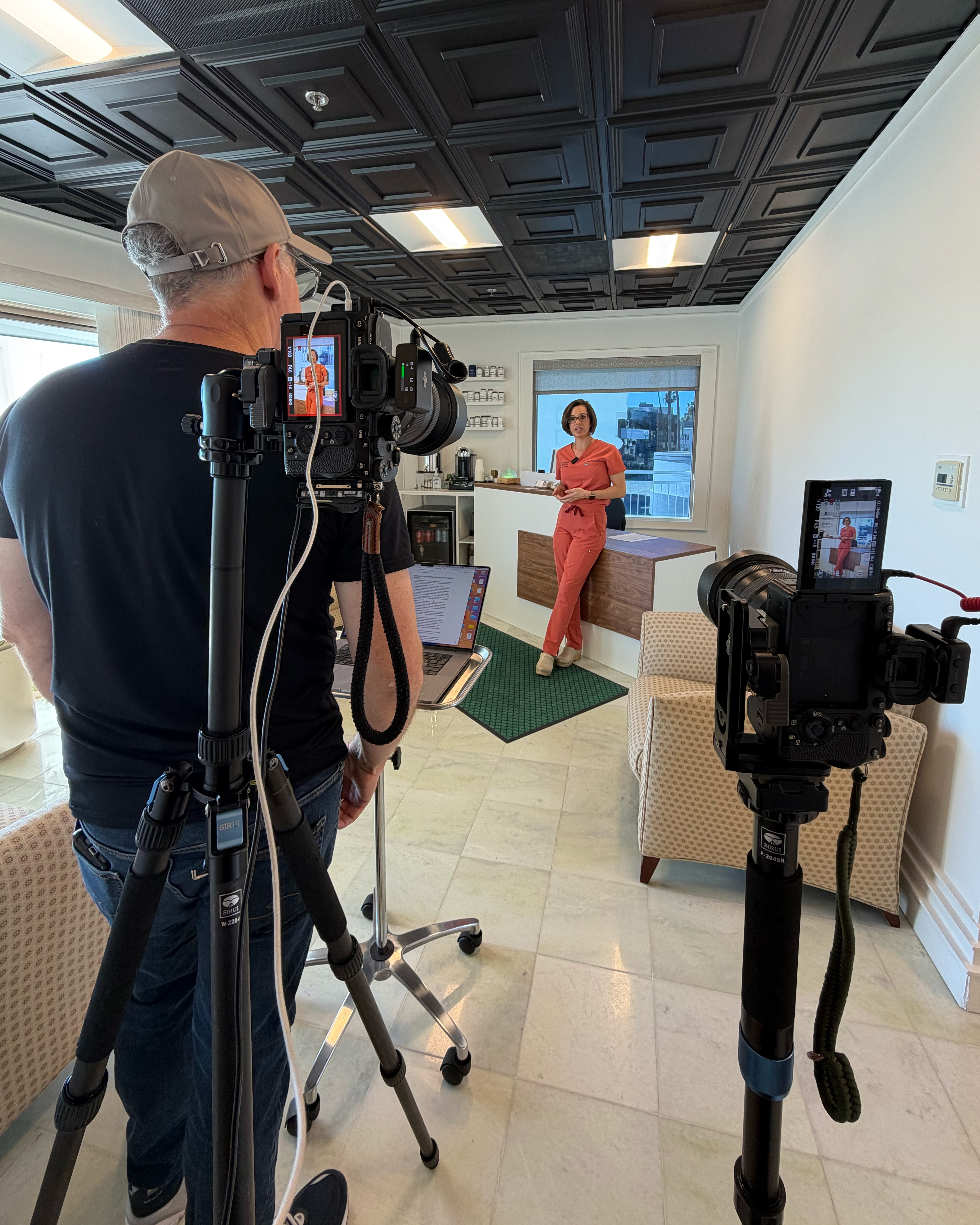 Behind the scenes of an on-location video shoot in a medical office.