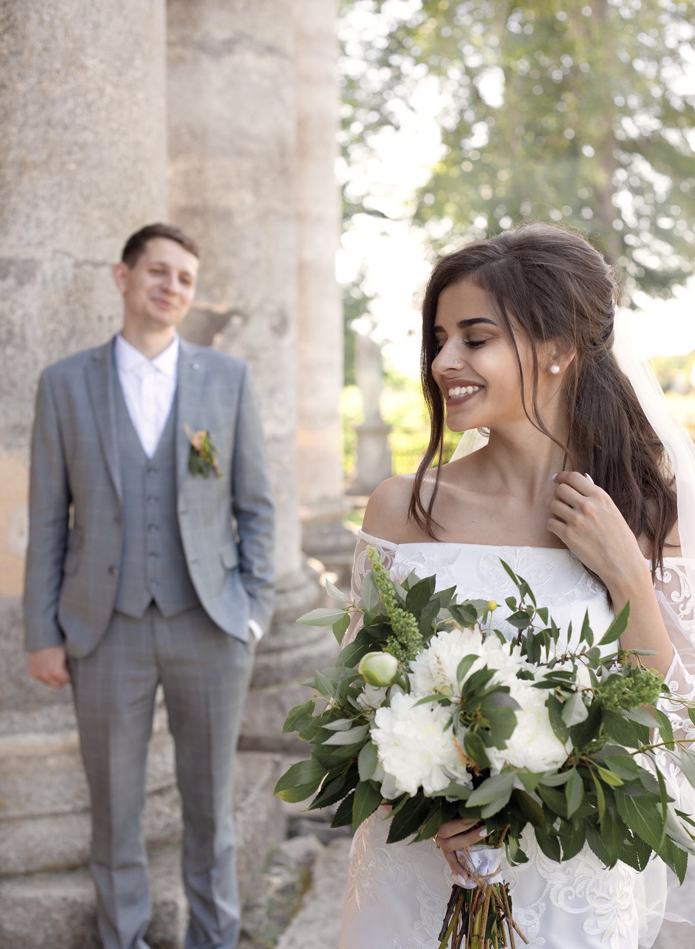 Bride holding white peony and lush garden greenery bouquet by Soulform Florals, Los Angeles