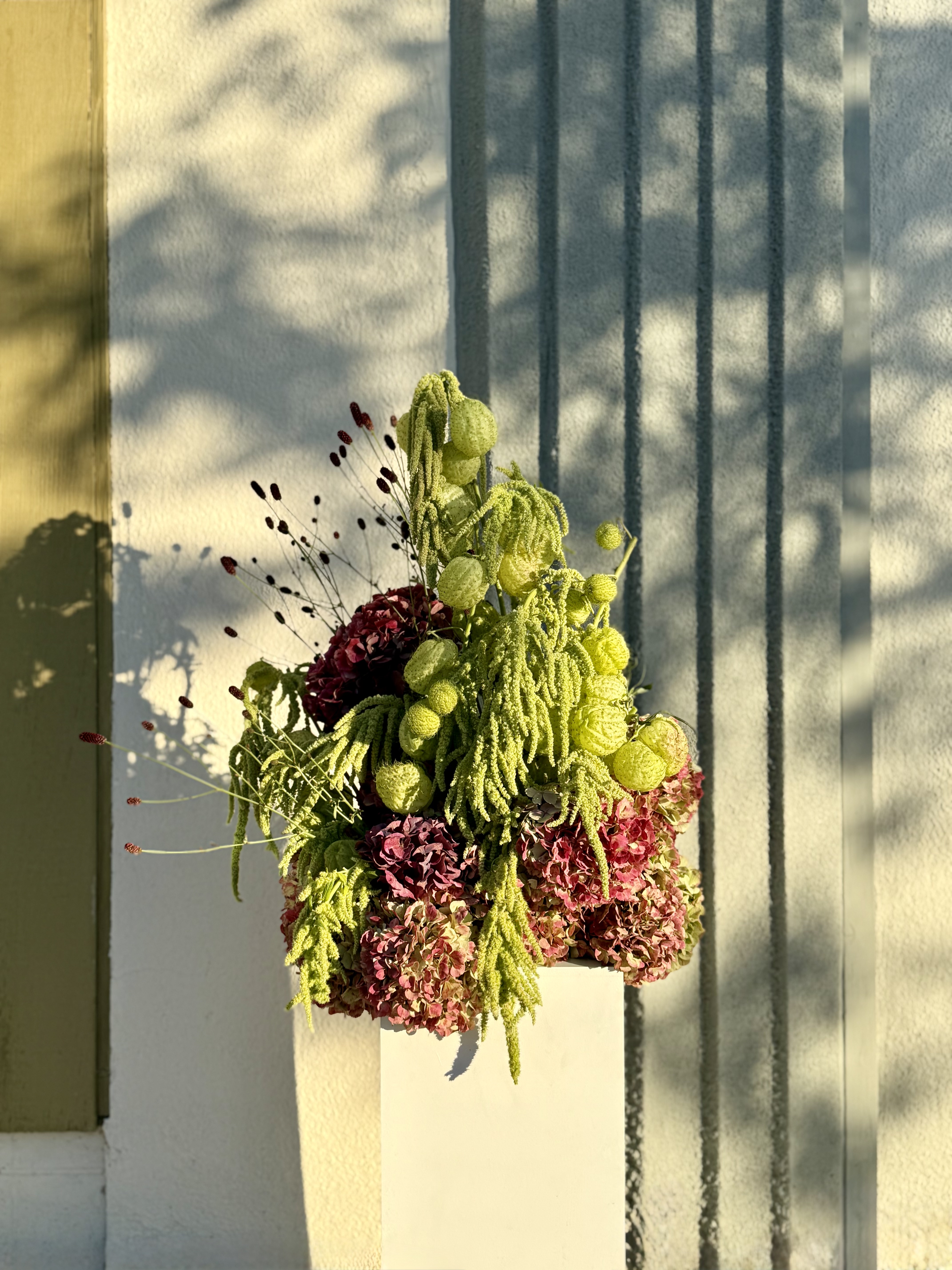 Bespoke autumn sunflower and chrysanthemum pedestal arrangement by Soulform Florals, Los Angeles
