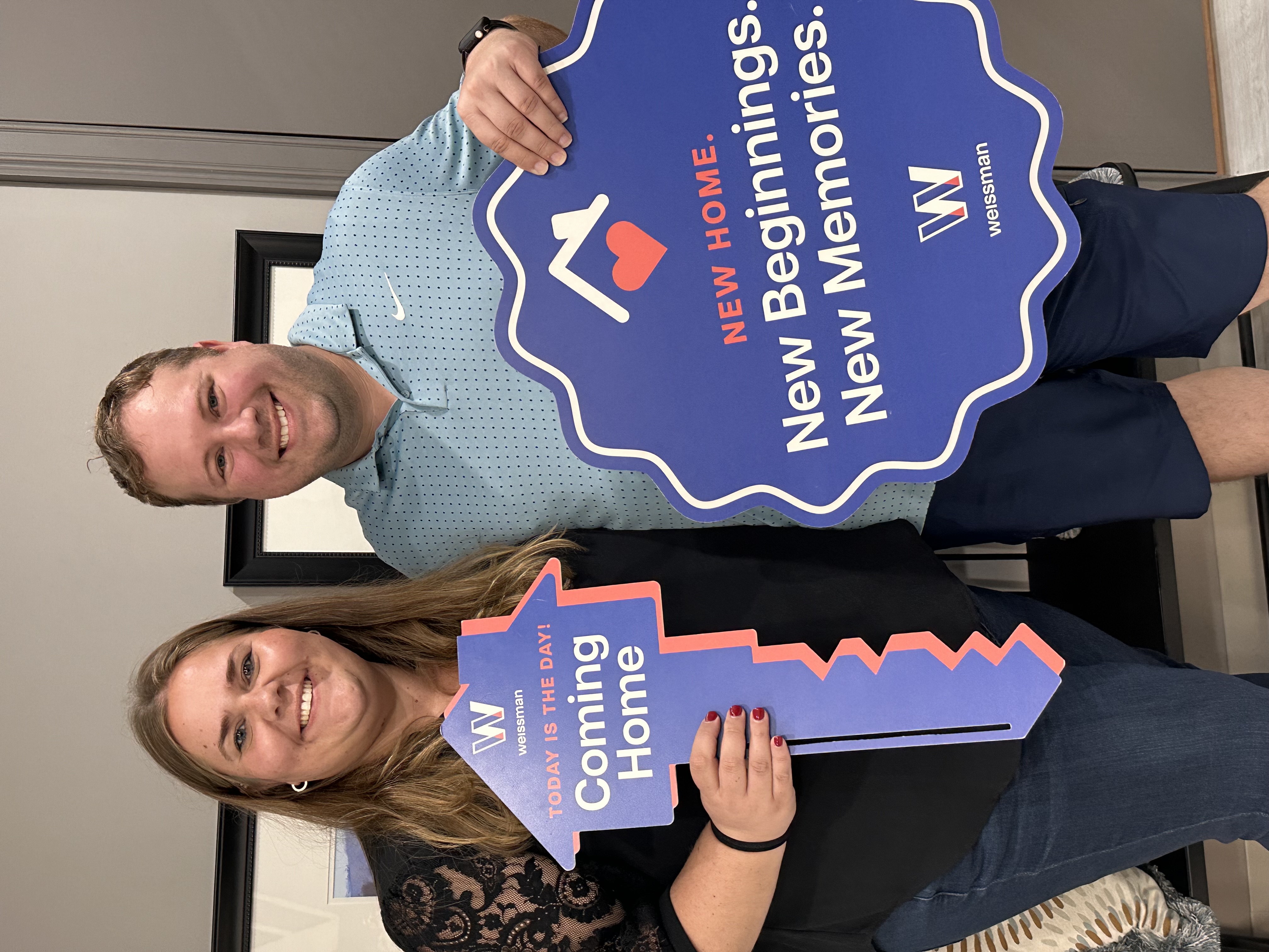 Stefanie & Alan holding the key to their new home in Atlanta