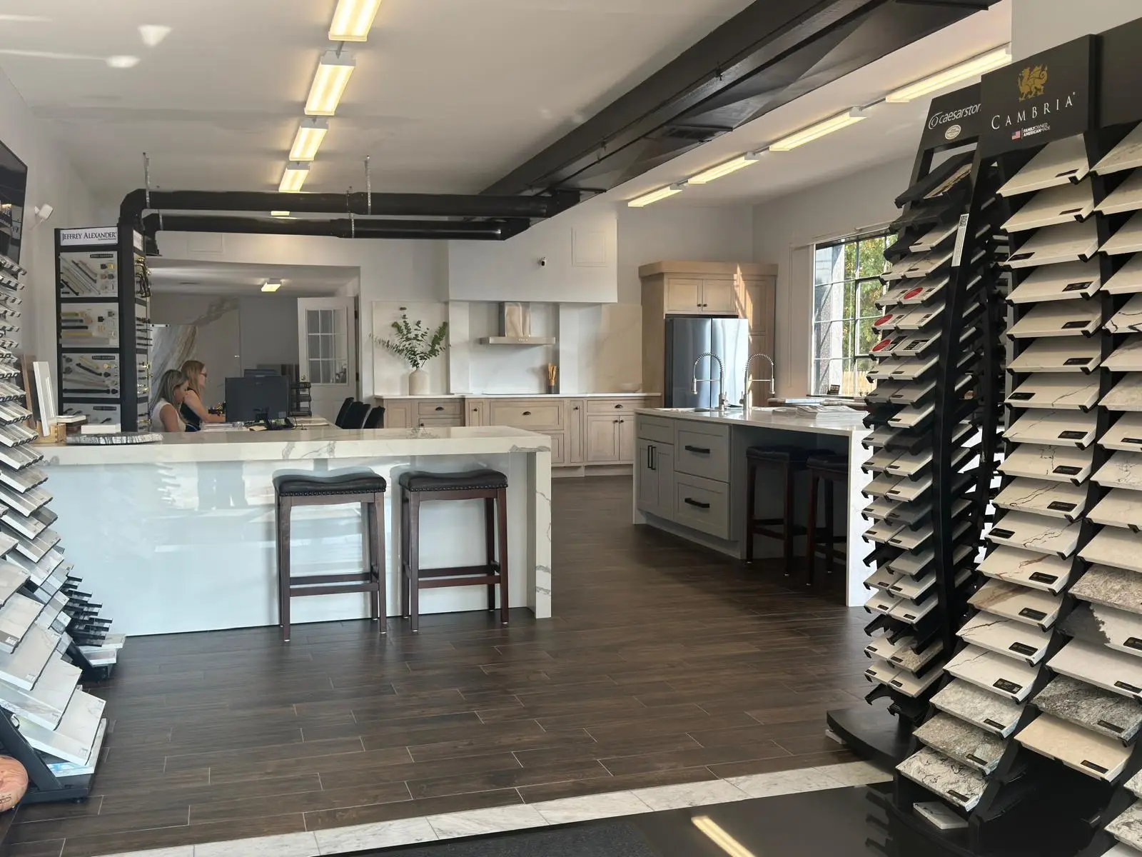 KCC quartz slab displays, stone countertop selections, and cabinetry