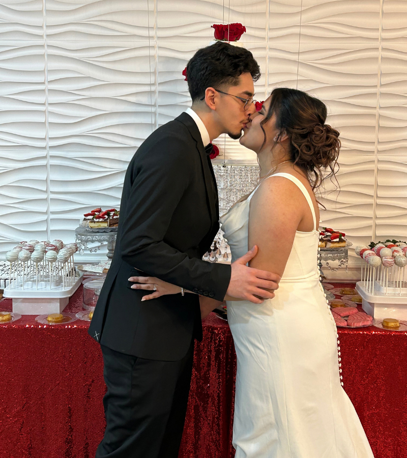 Bride and groom at the dessert table at The LayR Event Venue