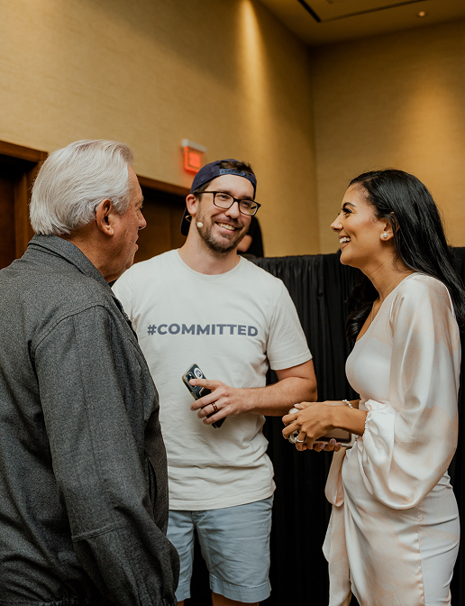 JC Hite conversing warmly with attendees and colleagues at a business event