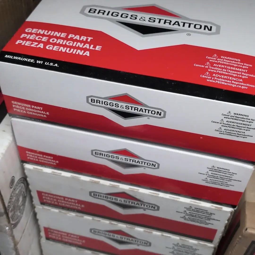 Stack of genuine Briggs & Stratton OEM parts used for generator repairs