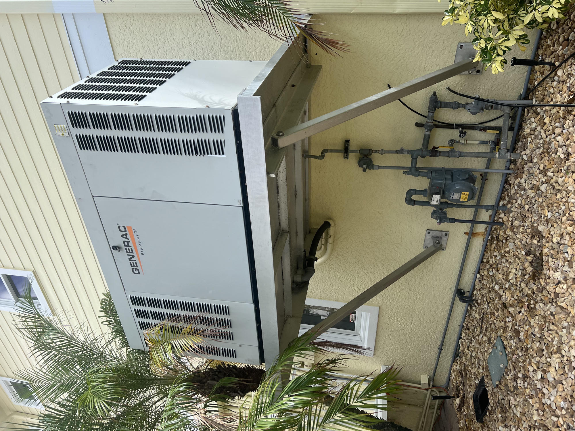 Whole-home Generac standby generator mounted at a Southwest Florida residence