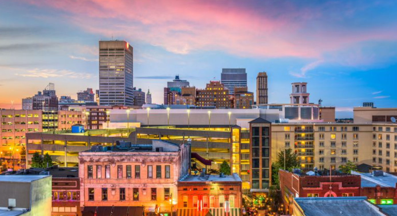 Sunset over vibrant Middle Tennessee city skyline and historic rooftops