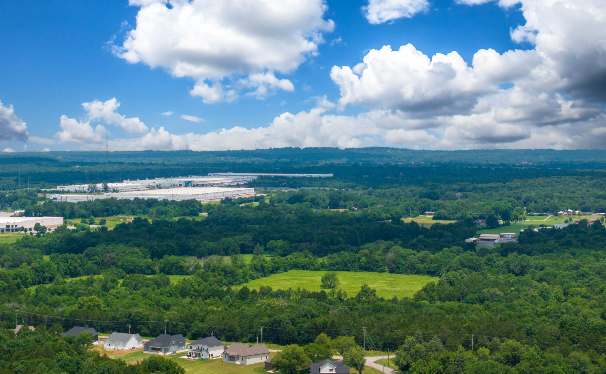 Aerial view of lush green rolling hills and countryside in Wilson County, Tennessee