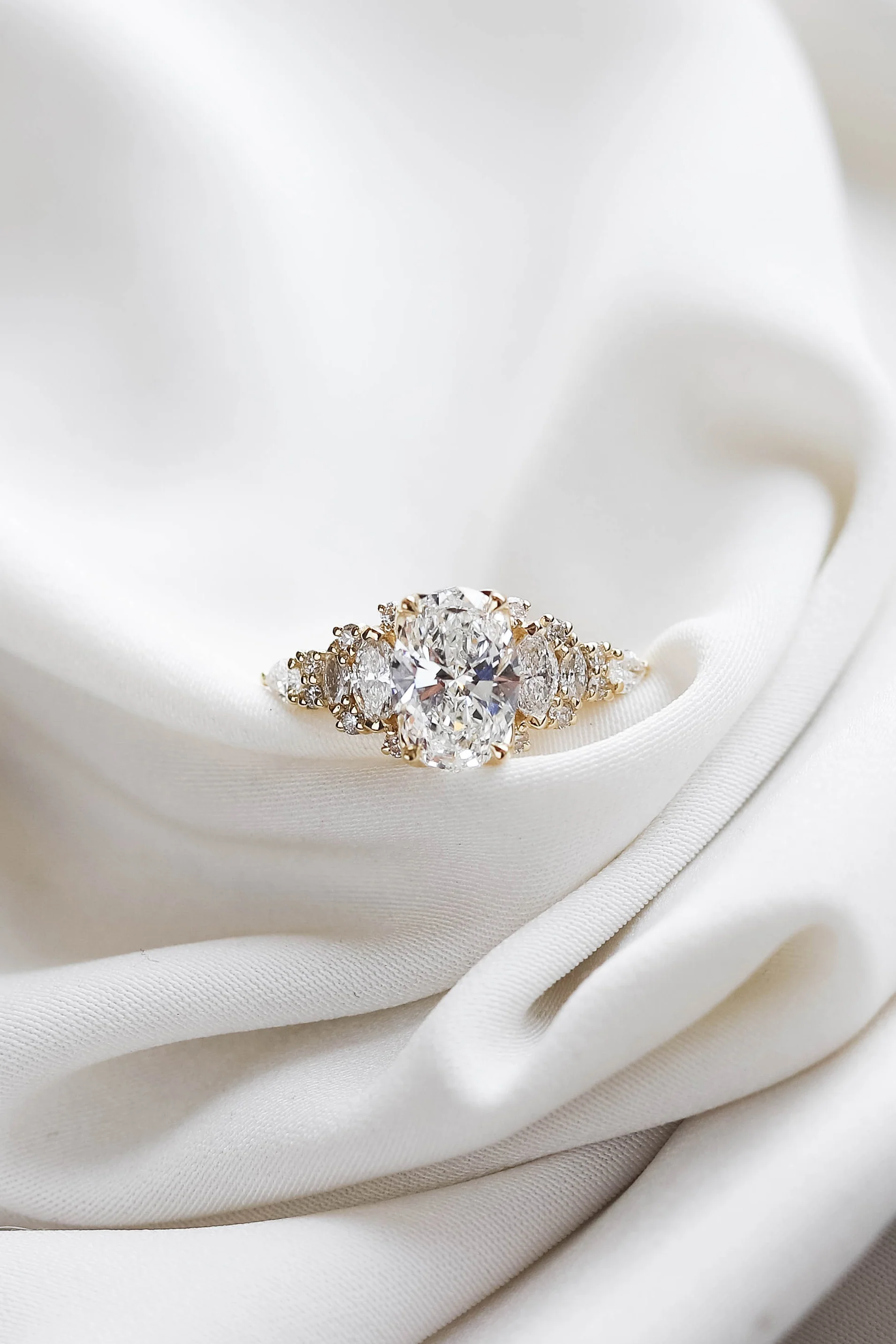 2.00ct lab-grown oval-cut diamond engagement ring set in warm yellow gold by Beaudell Diamonds