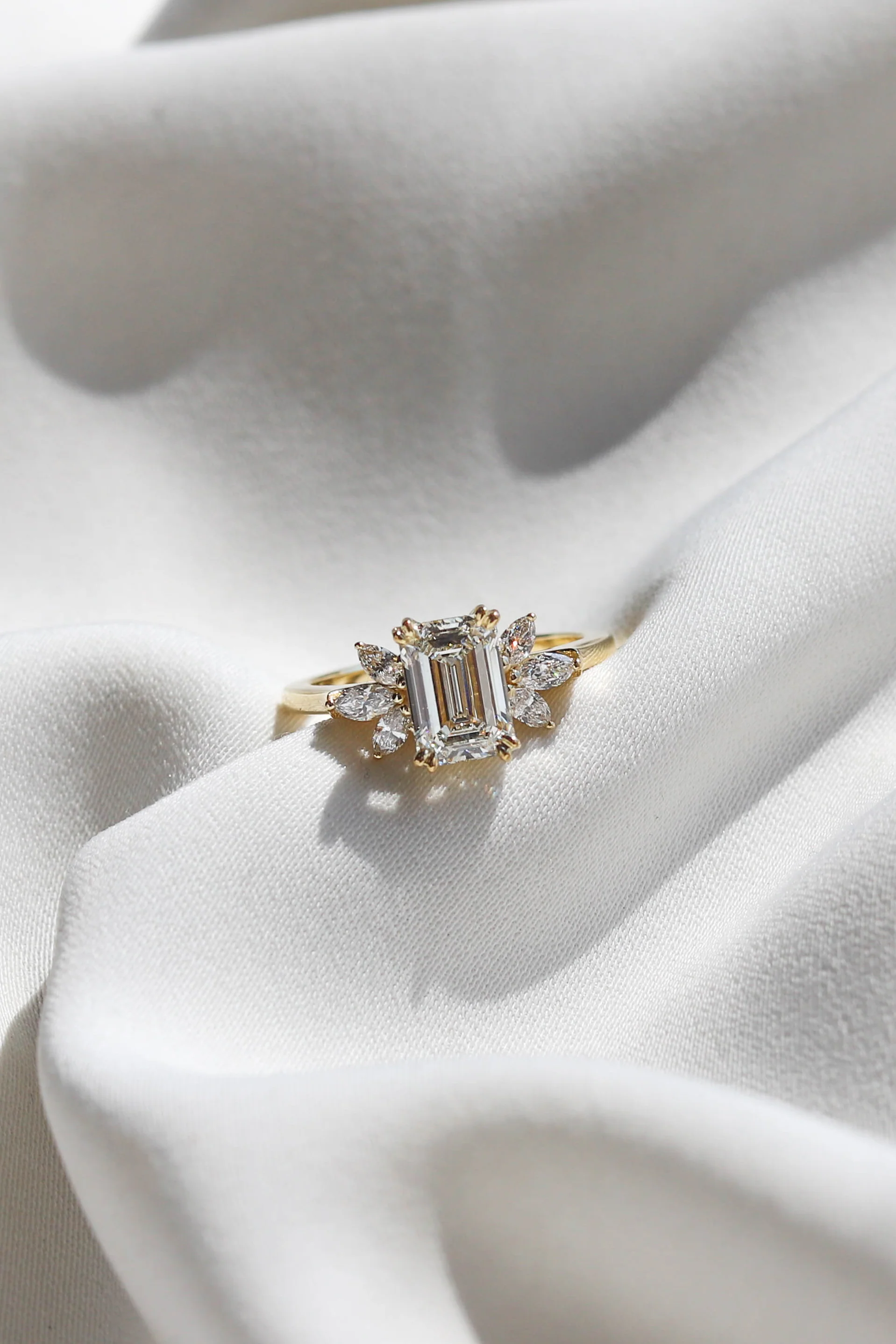 1.50ct lab-grown emerald-cut diamond engagement ring set in warm yellow gold by Beaudell Diamonds