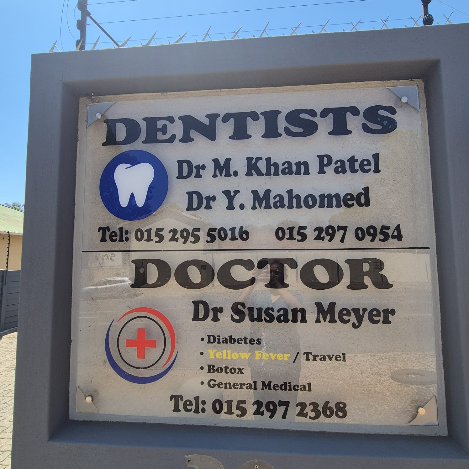 Practice entrance sign displaying Dr M. Khan Patel / Dr Y. Mahomed Dentists
