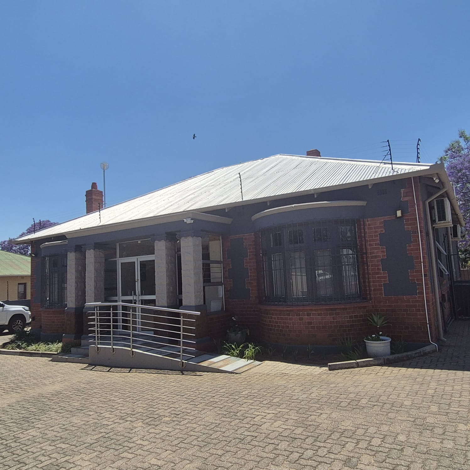 Exterior view of our dental practice building in Polokwane with ramp access and parking