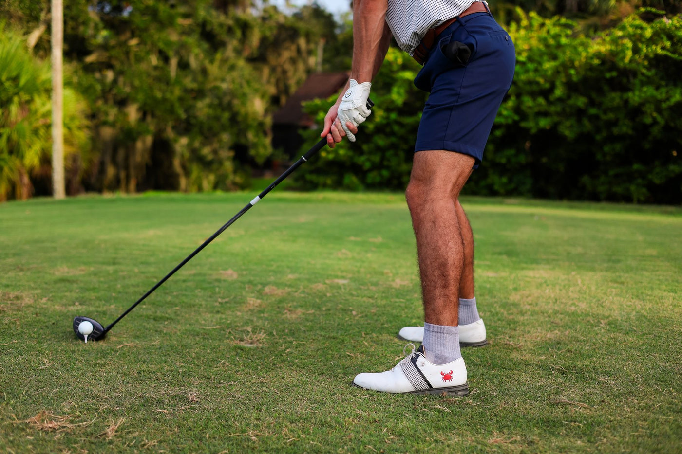 Del Campo socks worn on golf course green turf