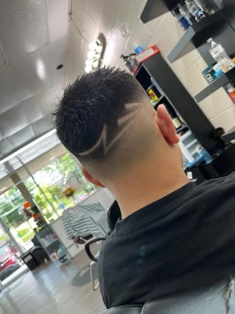 Precision Razor Fade with Geometric Hair Tattoo Art