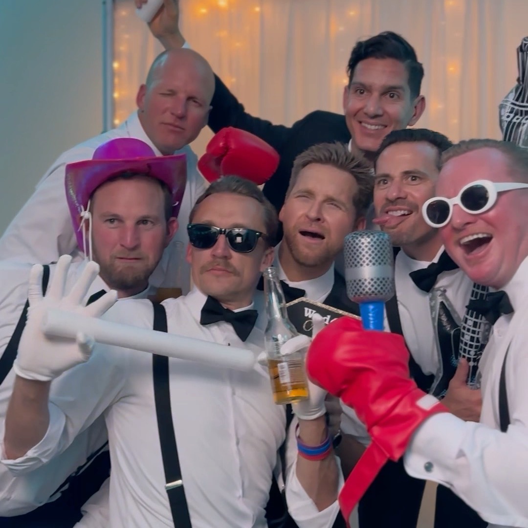 Wedding guests and party having a blast with props and sunglasses at the PRC photo booth