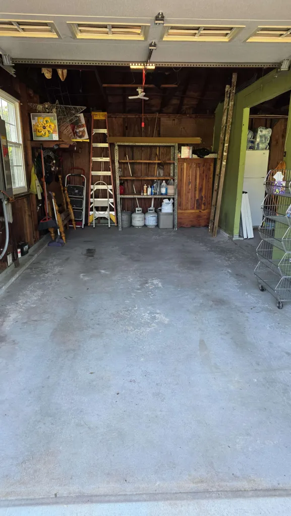 Completely cleared and swept garage with clear floor ready to park vehicles after Anchorline cleanout