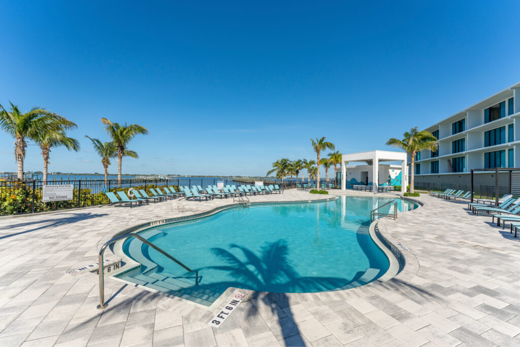 Resort-style community pool overlooking the water