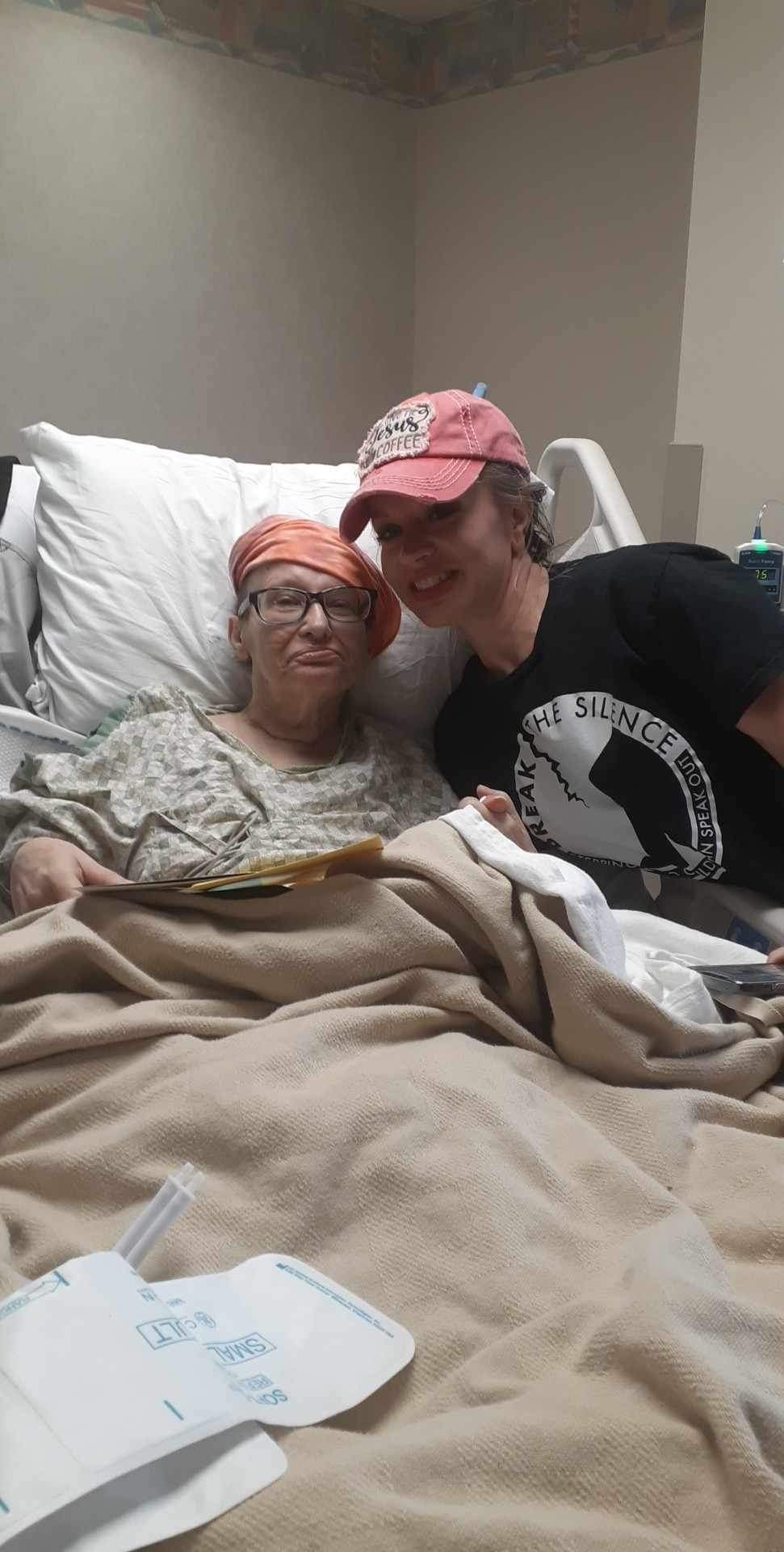 Theresa beside her mom Susan, sharing a tender and loving moment together