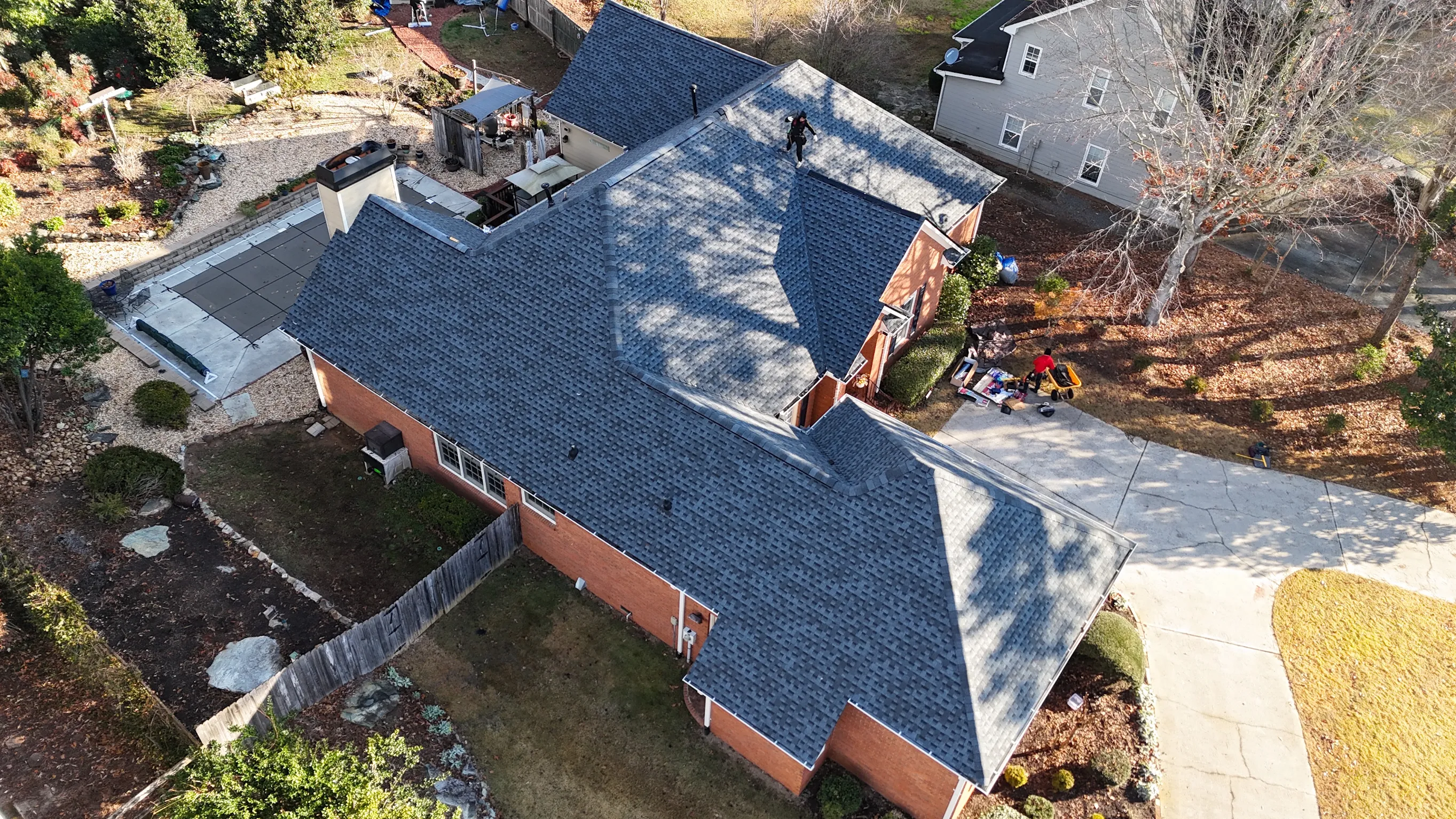 Aerial view of completed Pewter Grey architectural shingle roof replacement for KAS GA by Apex Roofing Solutions