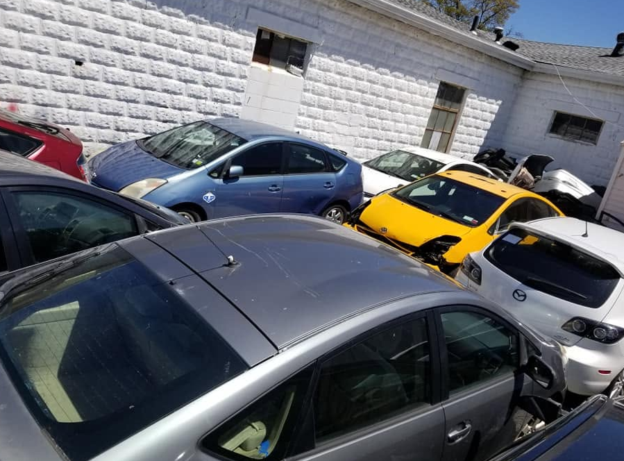 Toyota Prius vehicles outside our Copiague shop undergoing service